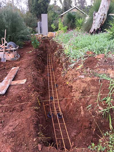 Landscaping construction - laying foundations for boundary wall